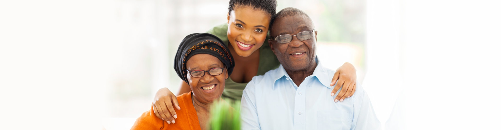 senior couple and their caregiver